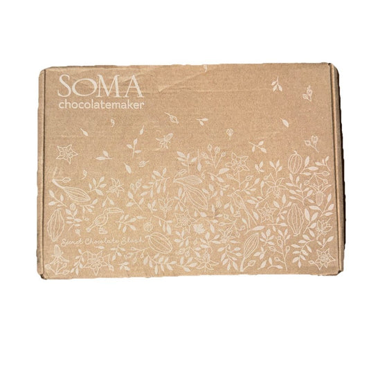 Soma Mango Chili Chocolate – Case of 12 Bars – Best Before Jan 2026 – a brown box with white flowers on it