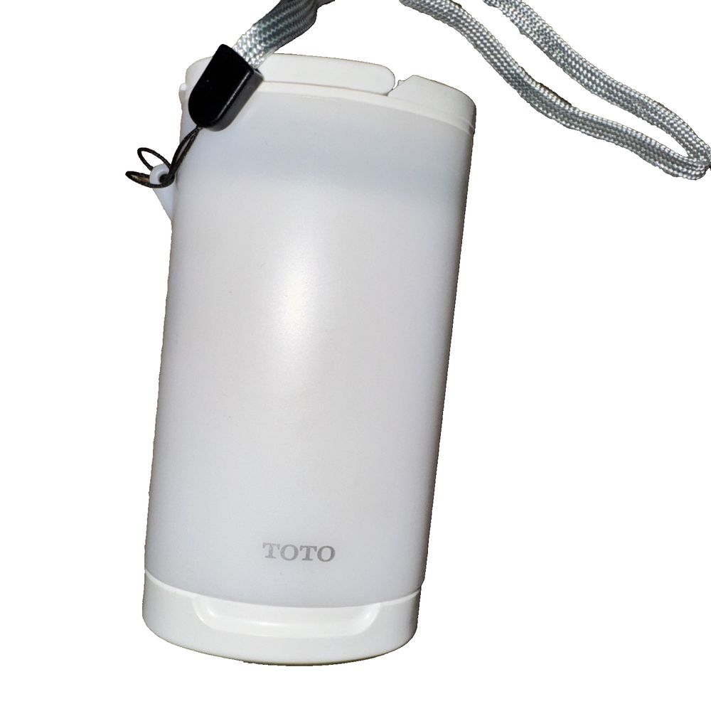 Toto HW300-W Portable Travel Washlet, White - HW300#W, 180 ml – a white water bottle with a black strap