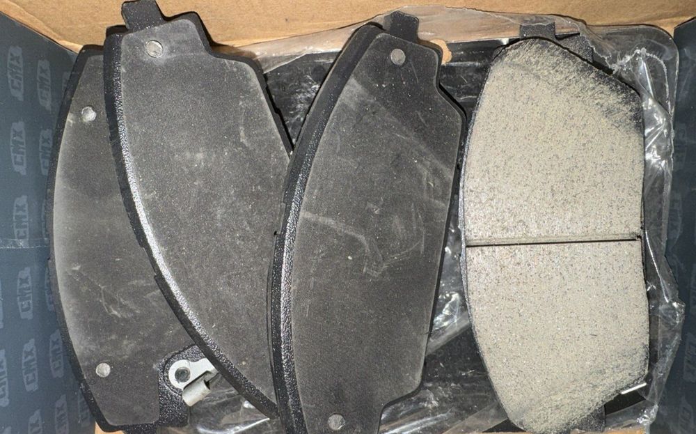 Front Ceramic Disc Brake Pads CMX-D1728 For Mazda 3 CX-3 Sport – a box of brake pads and a pair of brake pads
