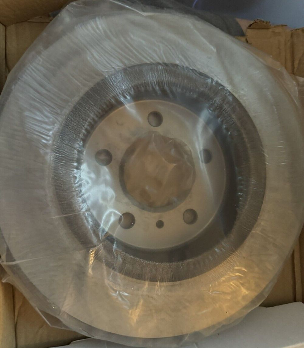 ACDelco Gold 18A2484 Black Hat Rear Disc Brake Rotor, DaveyDooDeals – a white plastic plate sitting on top of a cardboard box