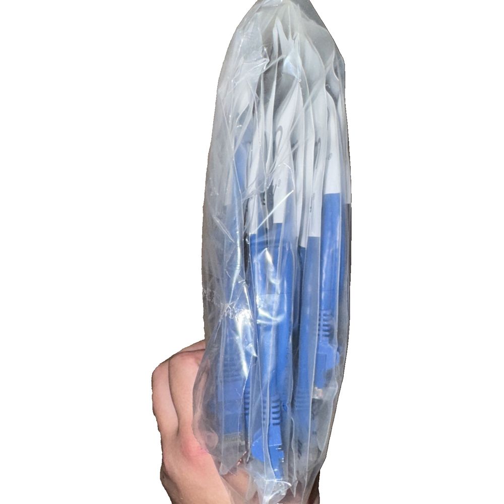 StarTech 3ft CAT6 Ethernet Cable - Blue CAT 6 Gigabit Ethernet Wire 10 Pack – a hand holding a plastic bag with a blue handle