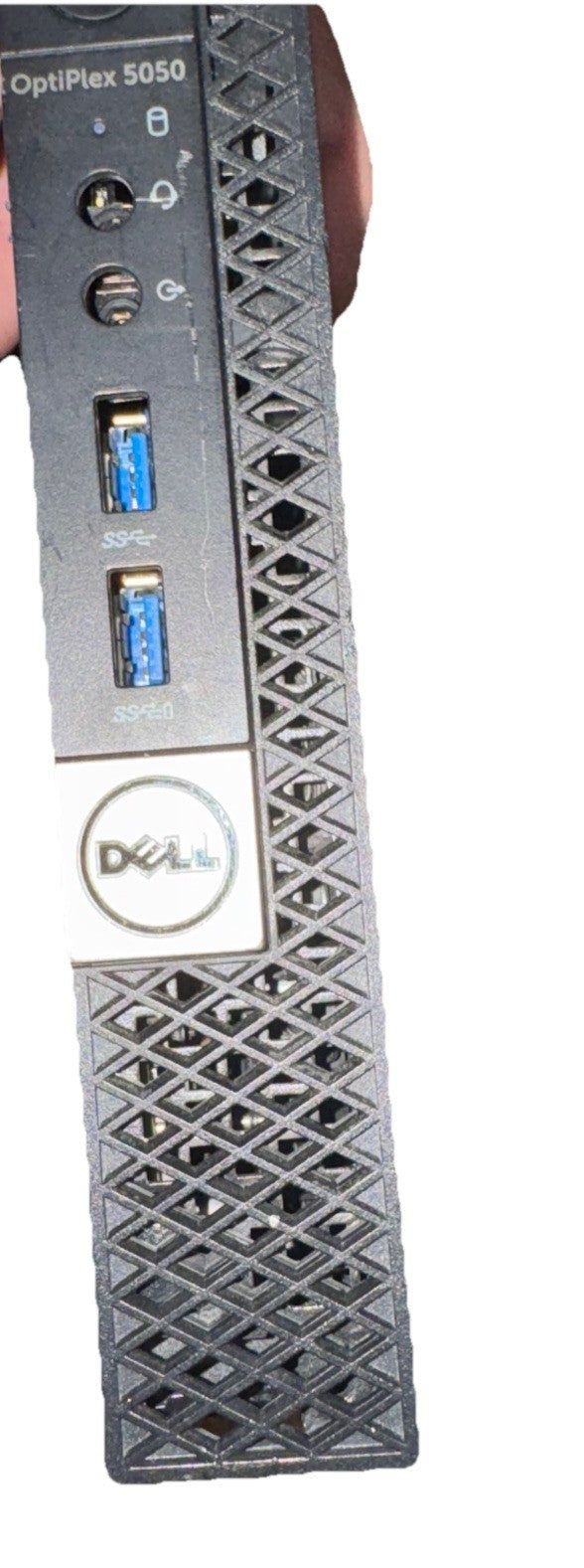 Dell optiplex 5050 Micro For Parts/Repair – a hand holding a black and white device