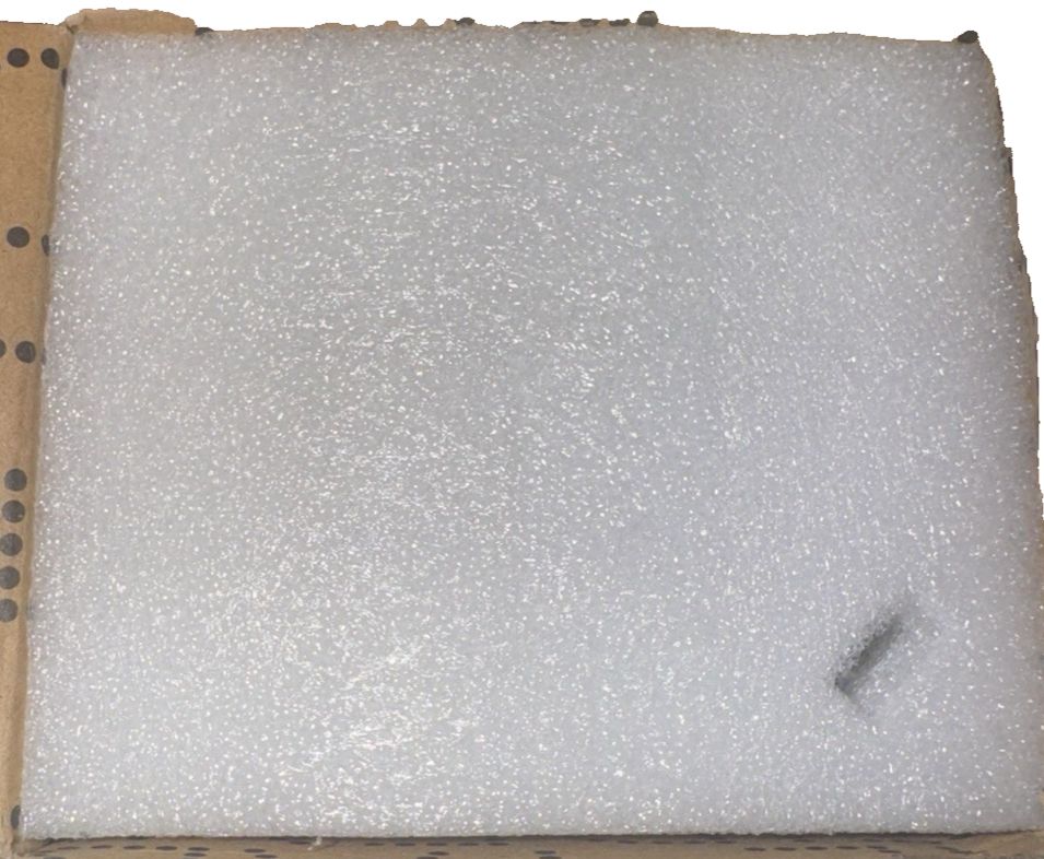 Curtis Stone Rechargeable Oil Mister Red – a piece of white foam with a brown cardboard box
