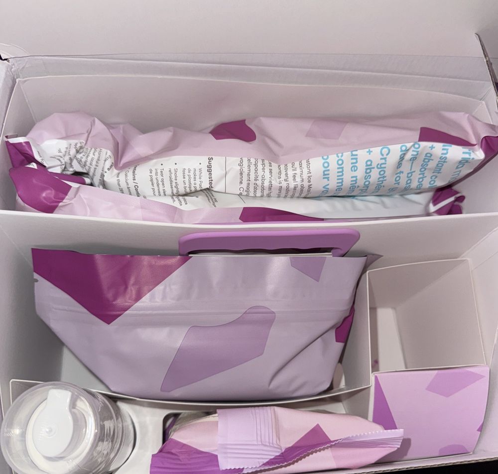 Frida Mom - Postpartum Recovery Essentials Kit EXP-2026-06-30 – a box with a lot of items inside