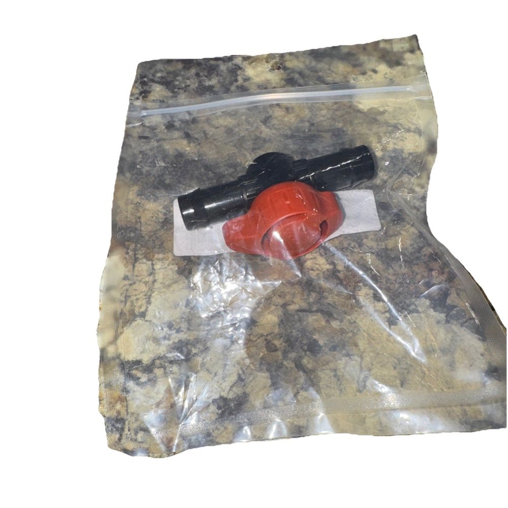 Two Little Fishies Ball Valve 5/8" Tube – a red plastic bag with a black handle