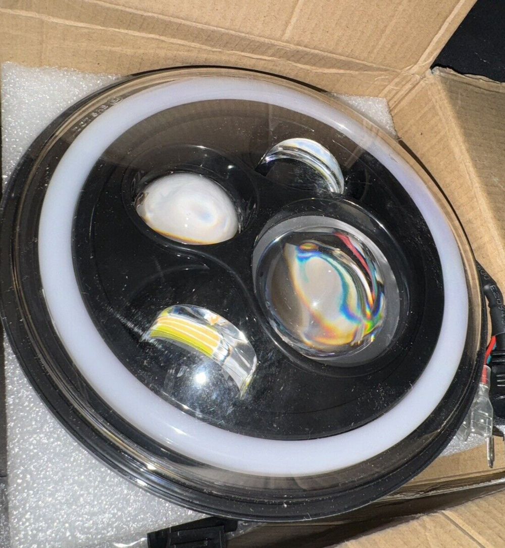 MGLLIGHT 7 Inch LED Headlights with Blue Halo Amber Turn Signal Lights H6024 LED – a box with a light inside of it
