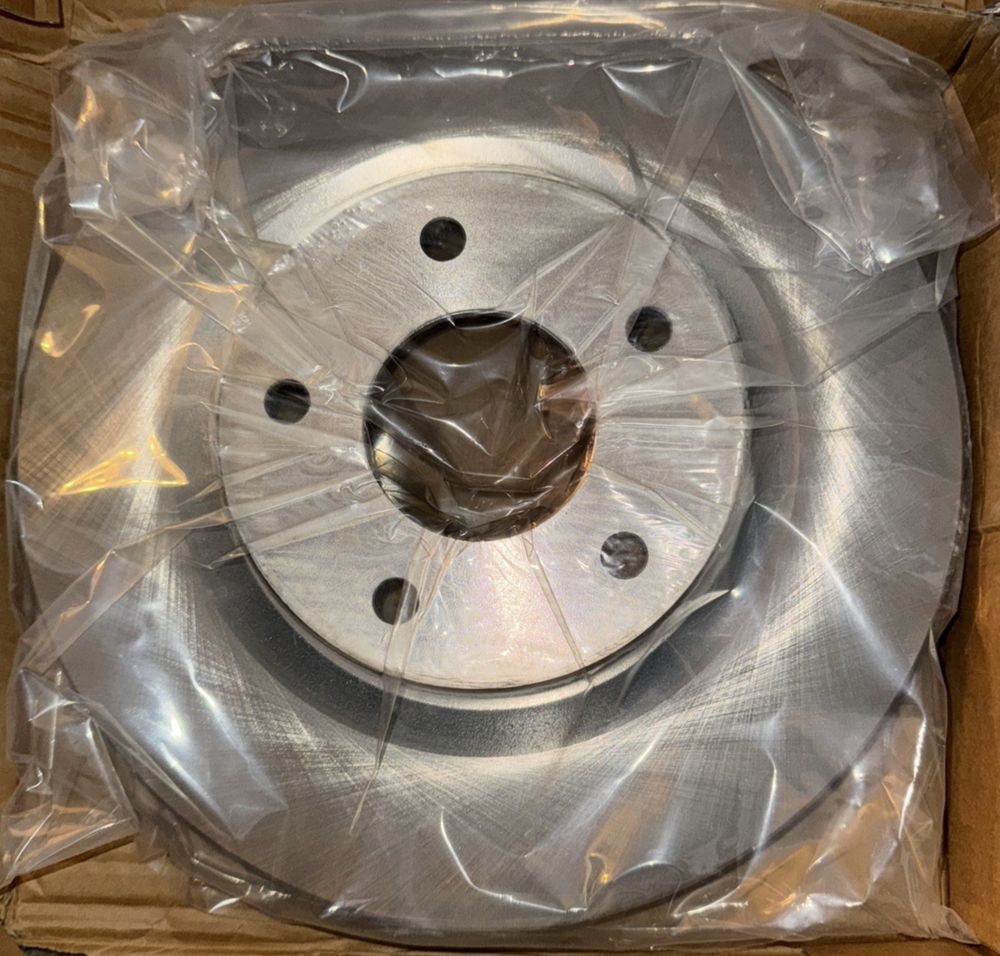Disc Brake Rotor-Top Quality Rotor Front Transit fits 13-19 Nissan 8-981780, CMX – a box with a metal disc inside