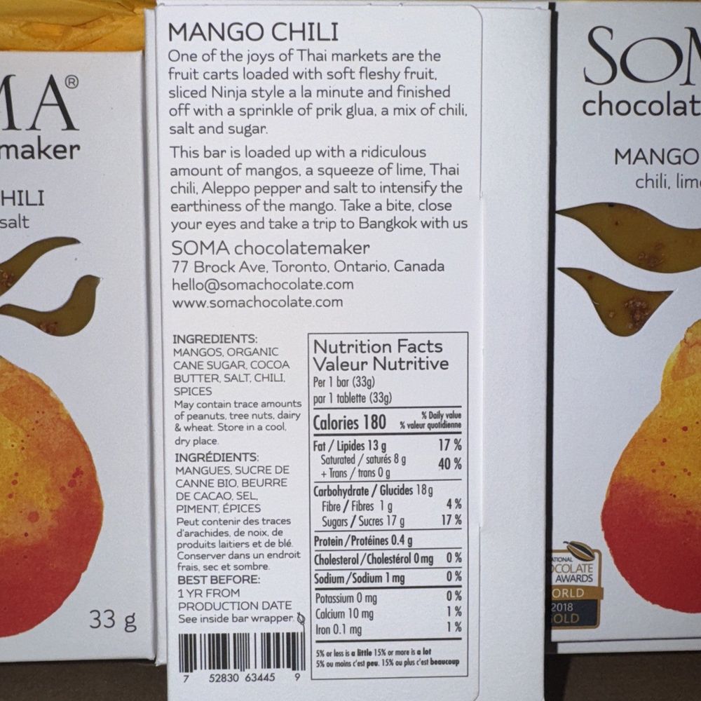 Soma Mango Chili Chocolate – Case of 12 Bars – Best Before Jan 2026 – a box of mango oil next to a box of mango oil