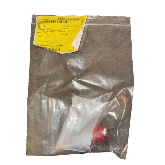 CAP/E-STOP WITH SEALING RING 7020175, UNknown – a bag of brown colored powder with a yellow label