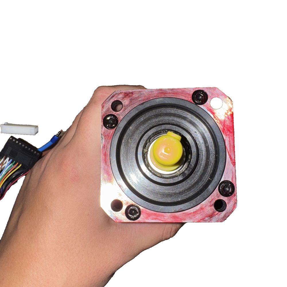 Infranor Mavilor Servo Motor FP0207900999B9 FP-0207 – a hand holding a small camera with a yellow light