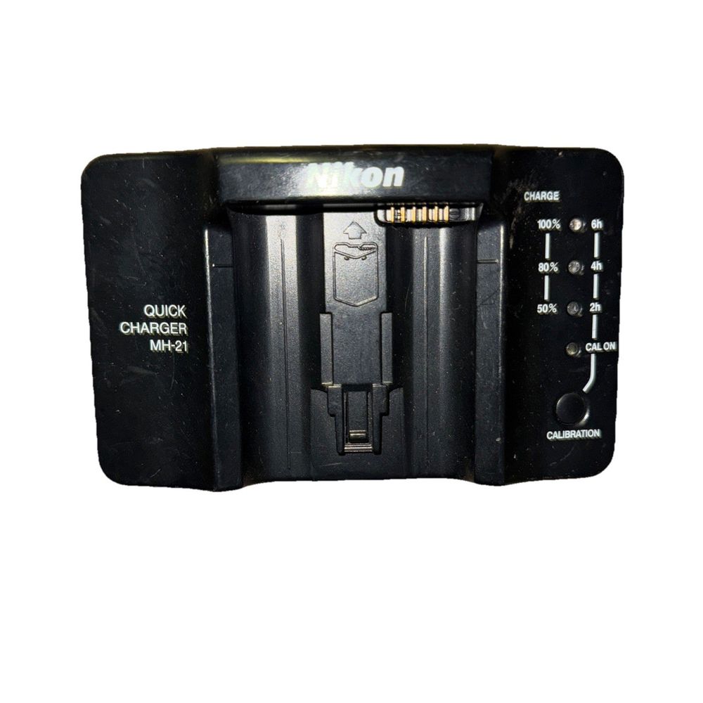 Nikon MH-21 Quick Charger No Power Cable – a black and white photo of a camera