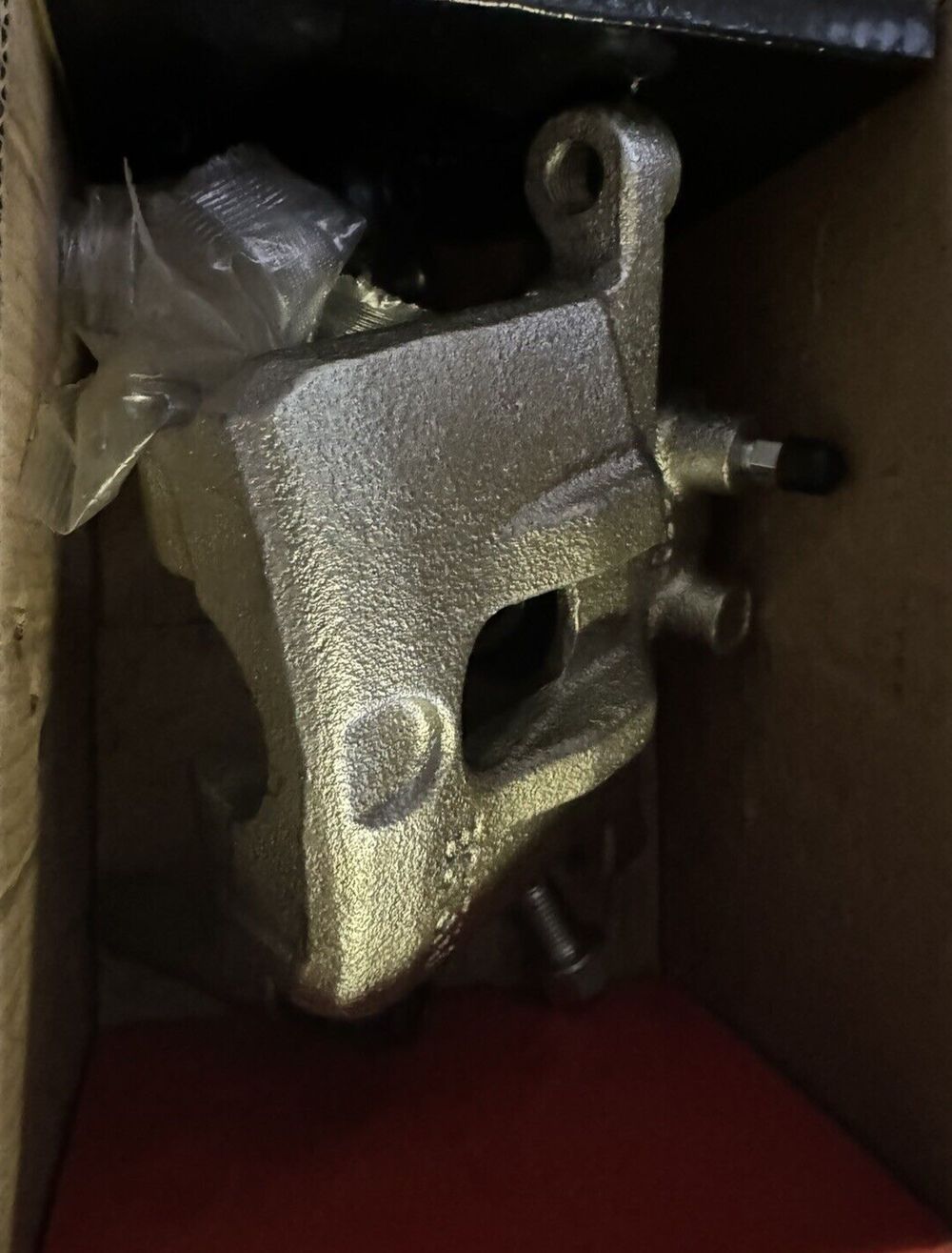 A-Premium Disc Brake Caliper Assembly with Bracket Compatible with Select Chrys – a metal animal head in a cardboard box