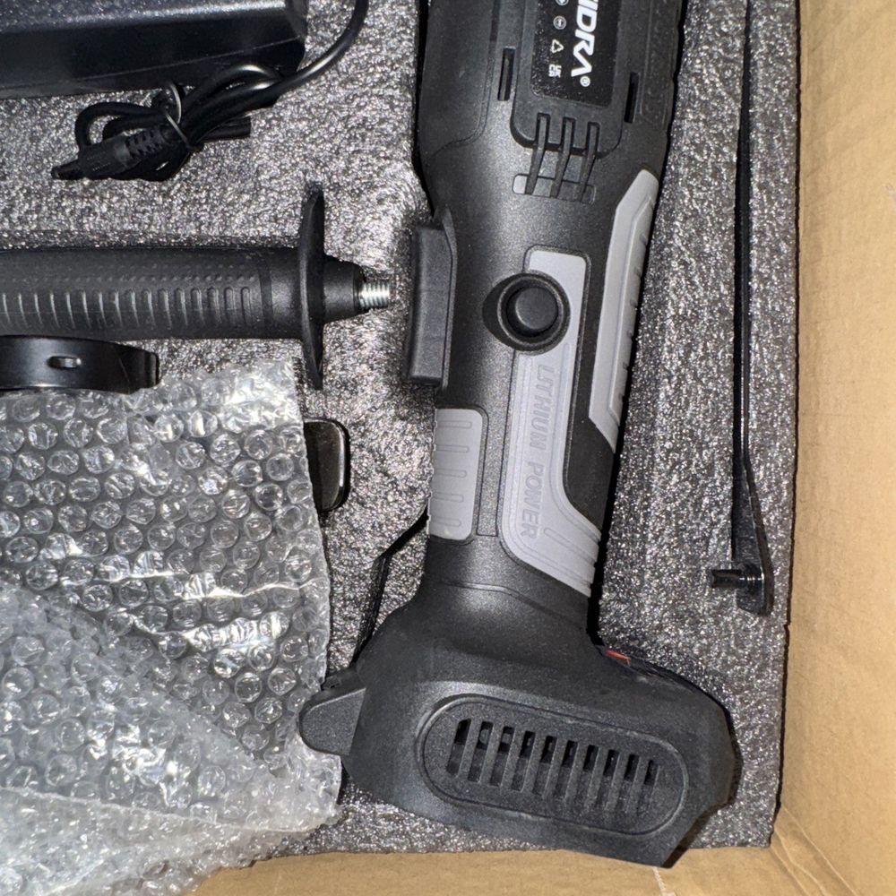 YoFidra Angle Grinder With 1 battery/Charger – a black and silver gun