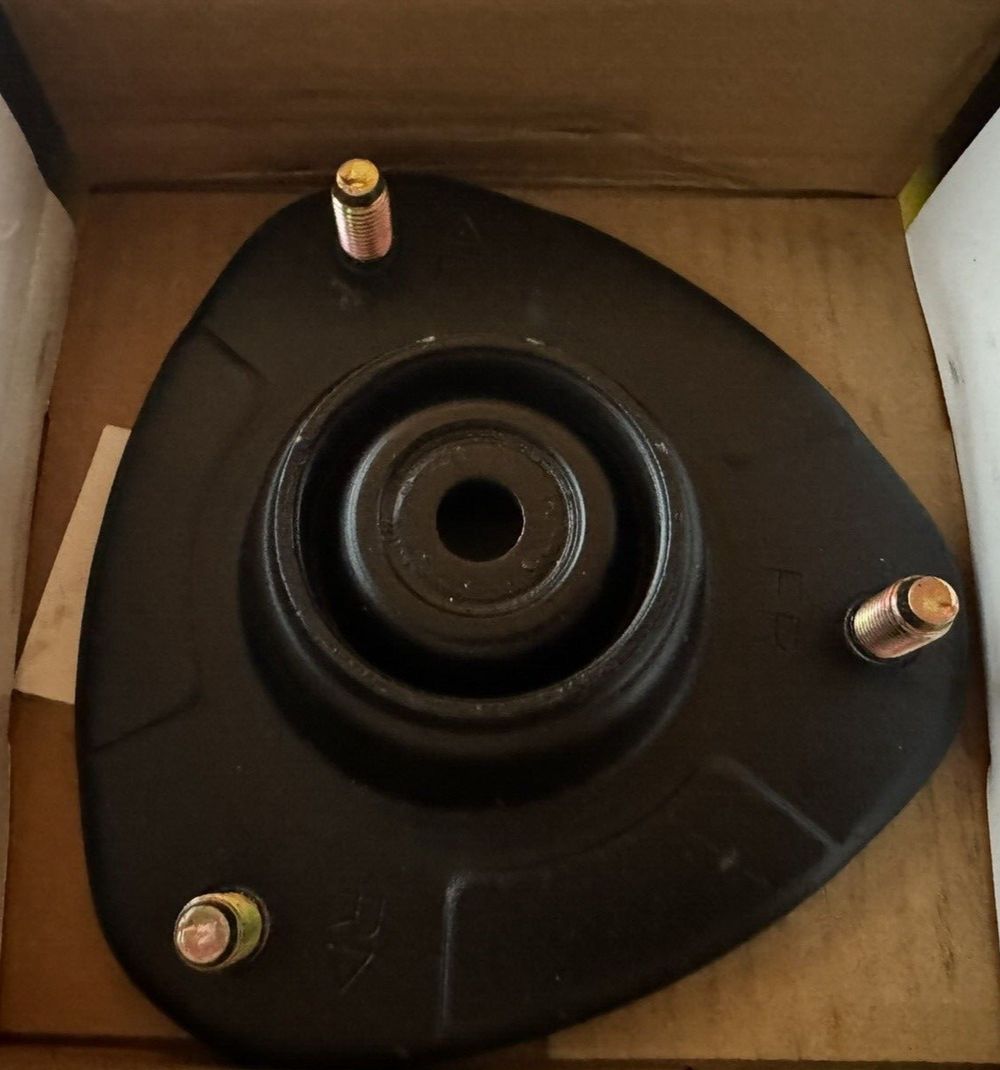Monroe Shocks & Struts Strut-Mate 905904 Suspension Strut Mount – a black wheel hub with a screw and nut