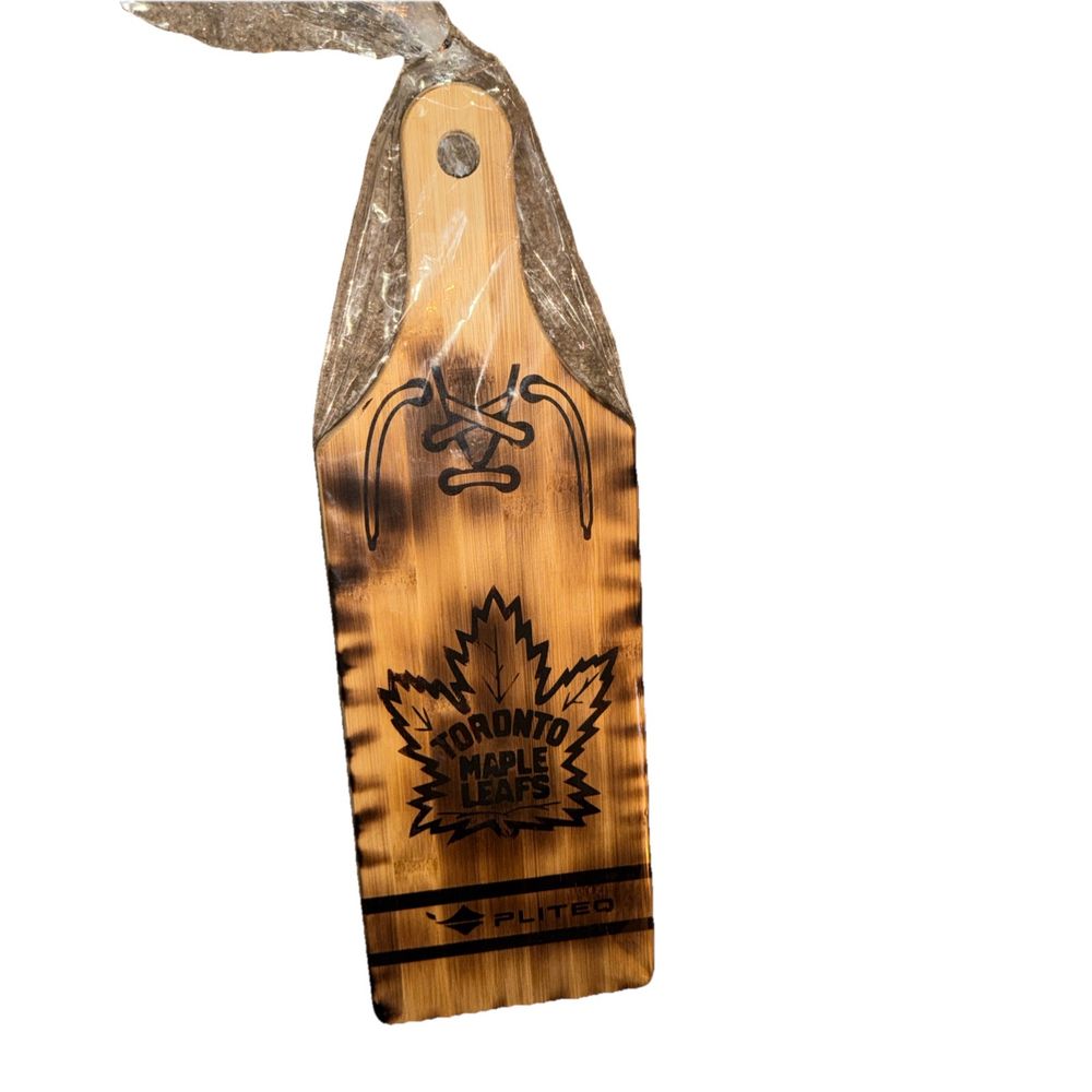 toronto maple leafs pliteq charcuterie board, Unbranded – a wooden paddle with a maple leaf design on it