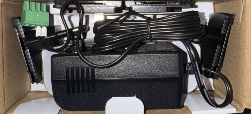 Netcomm AC POWER SUPPLY UNIT FOR NTC-22X (PSU-0079) – a box with a box of wires and a box of wires