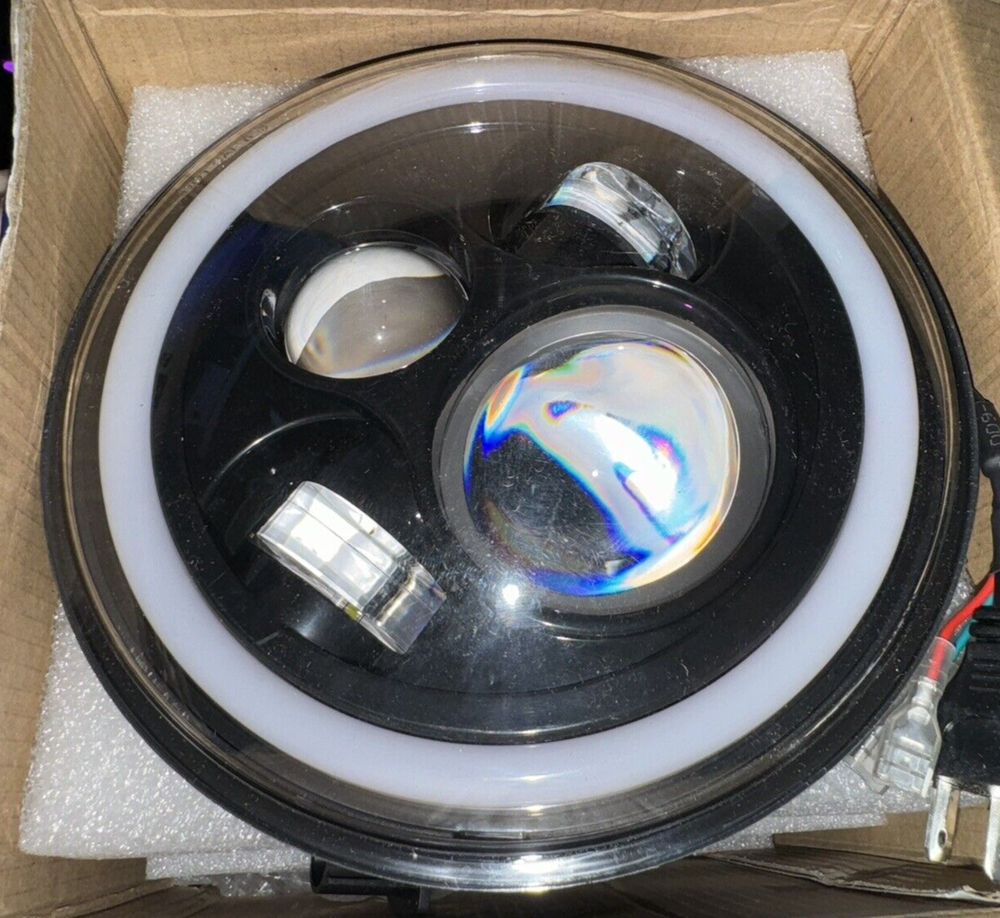 MGLLIGHT 7 Inch LED Headlights with Blue Halo Amber Turn Signal Lights H6024 LED – a box with a speaker inside of it