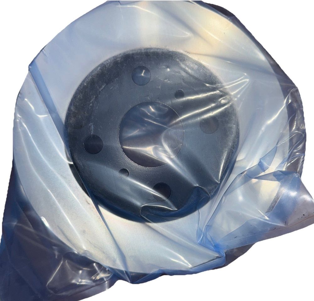 Wagner BD126409E Premium E-Coated Rotor, Front – a plastic bag with a black plastic object inside