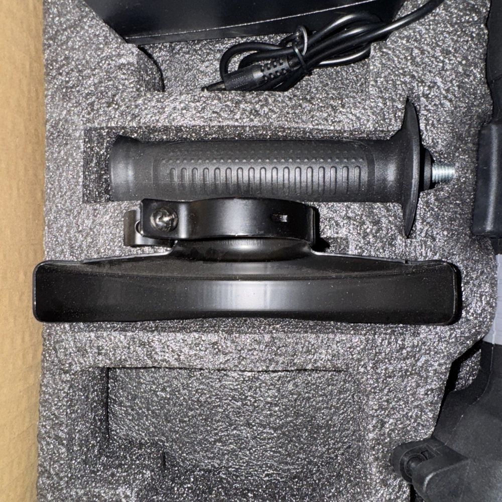 YoFidra Angle Grinder With 1 battery/Charger – a black knife and a black knife on a carpet