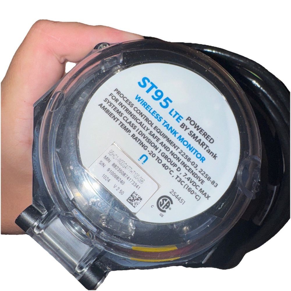 SMARTank Wireless Tank Level Monitor ST95 LTE w/GPS 108" 95WC1-W68G4, SmartTank – a hand holding a watch with a white dial