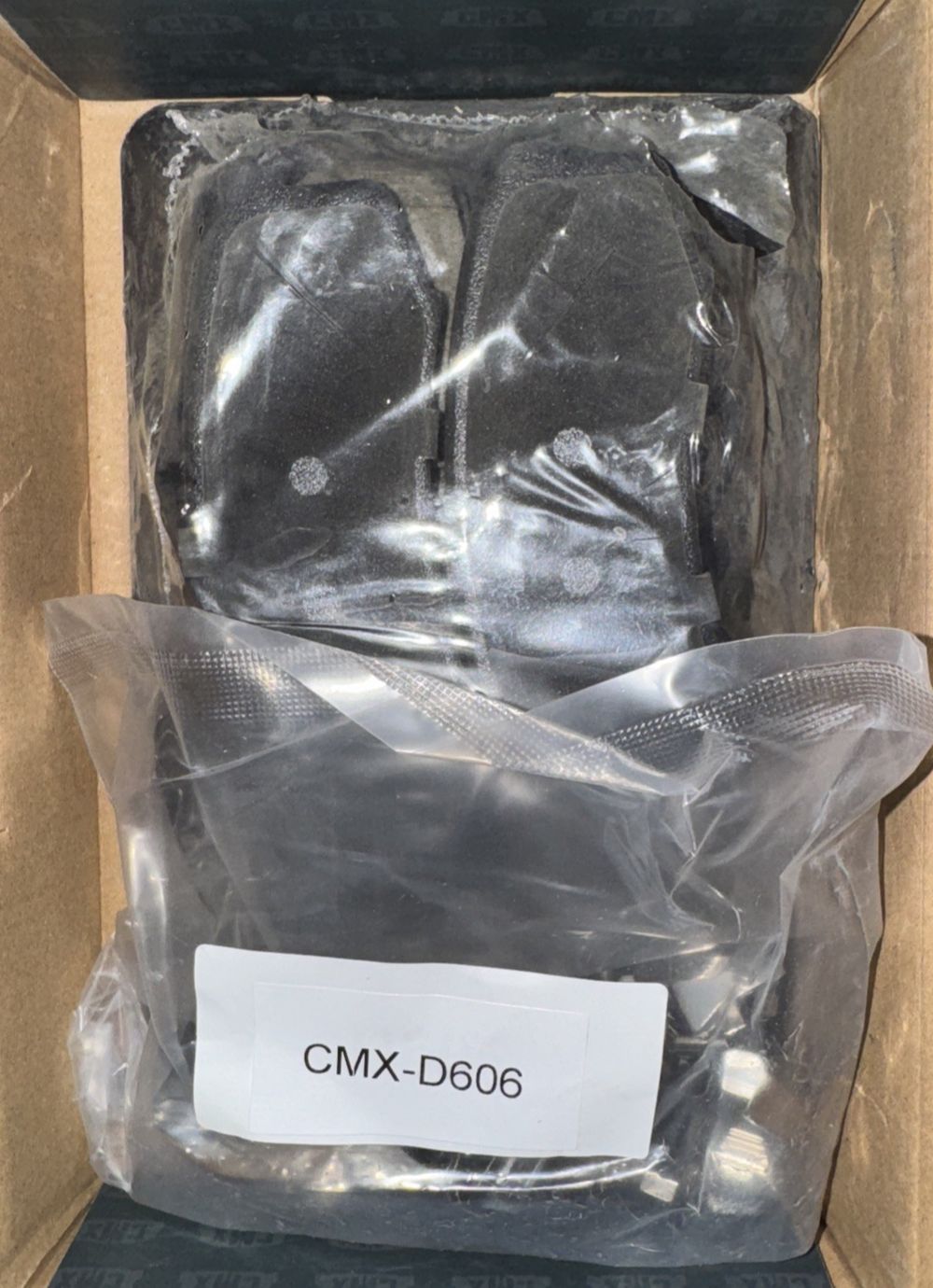 CMX Rear Ceramic Disc Brake Pads CMX-D606 Replacement For Toyota 4Runner – a box of black rubber pads in a cardboard box