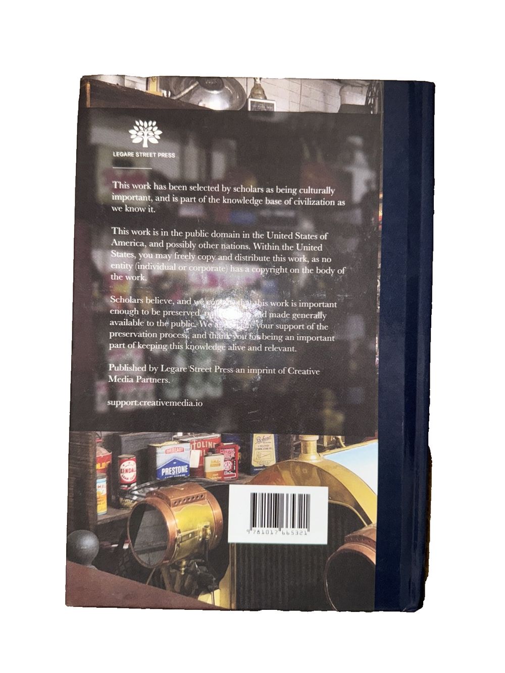 The Complete Motorist, DaveyDooDeals – the book cover for the book, the book is a black and white photo of a car