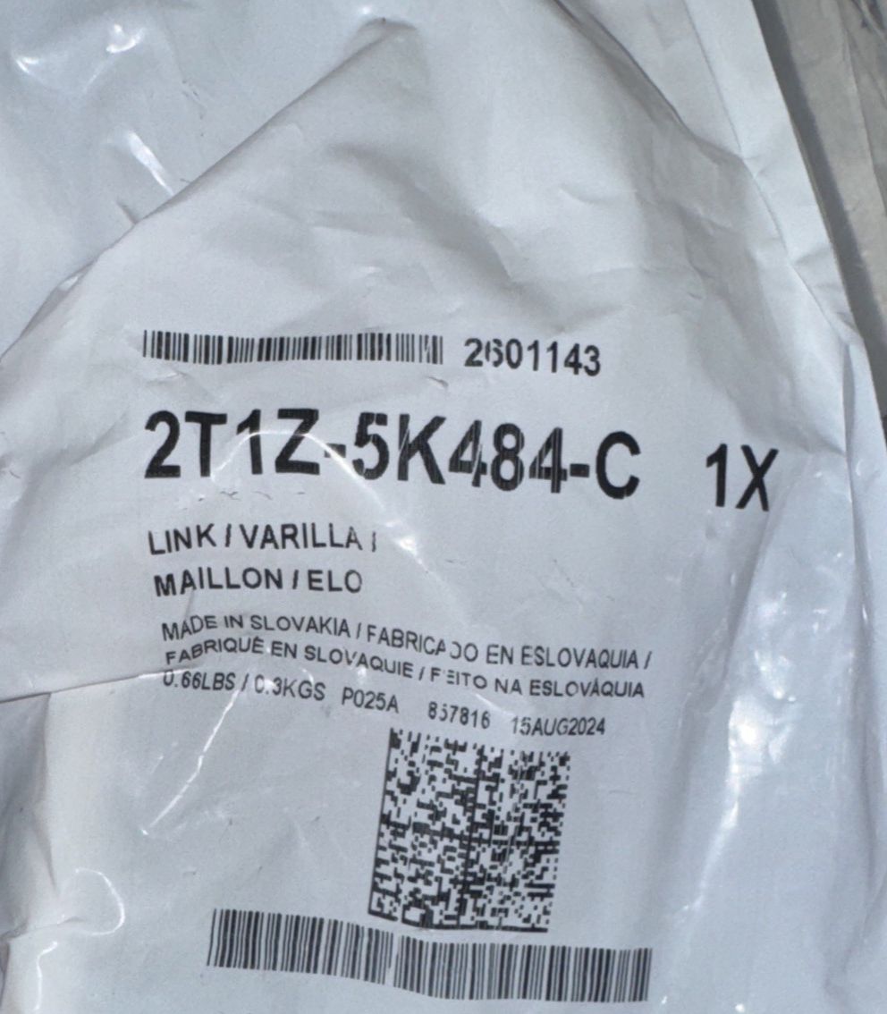 Stabilizer Link - Ford (2T1Z-5K484-C) – a white bag with a black and white label