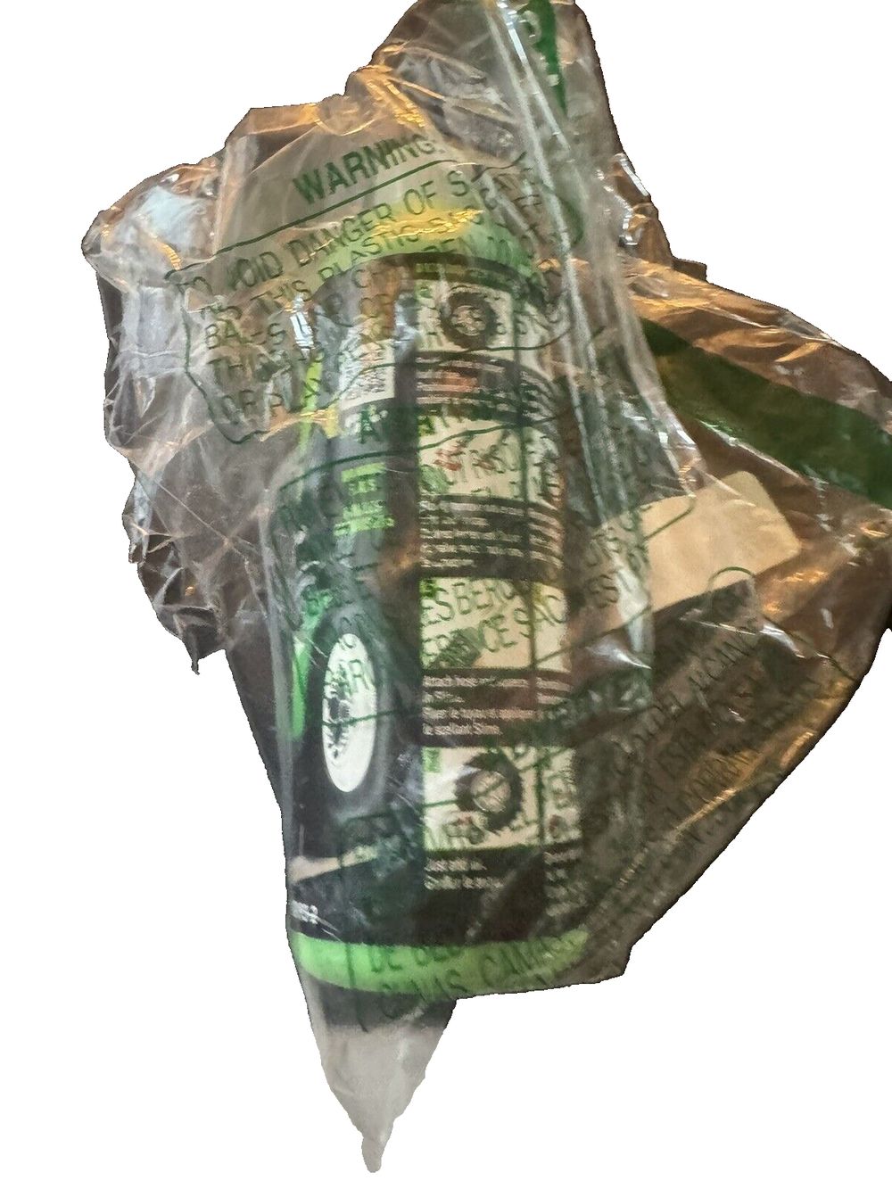 Slime 2-in-1 Tire & Tube Sealant, 473mL – a bag of green tea sitting on top of a white surface