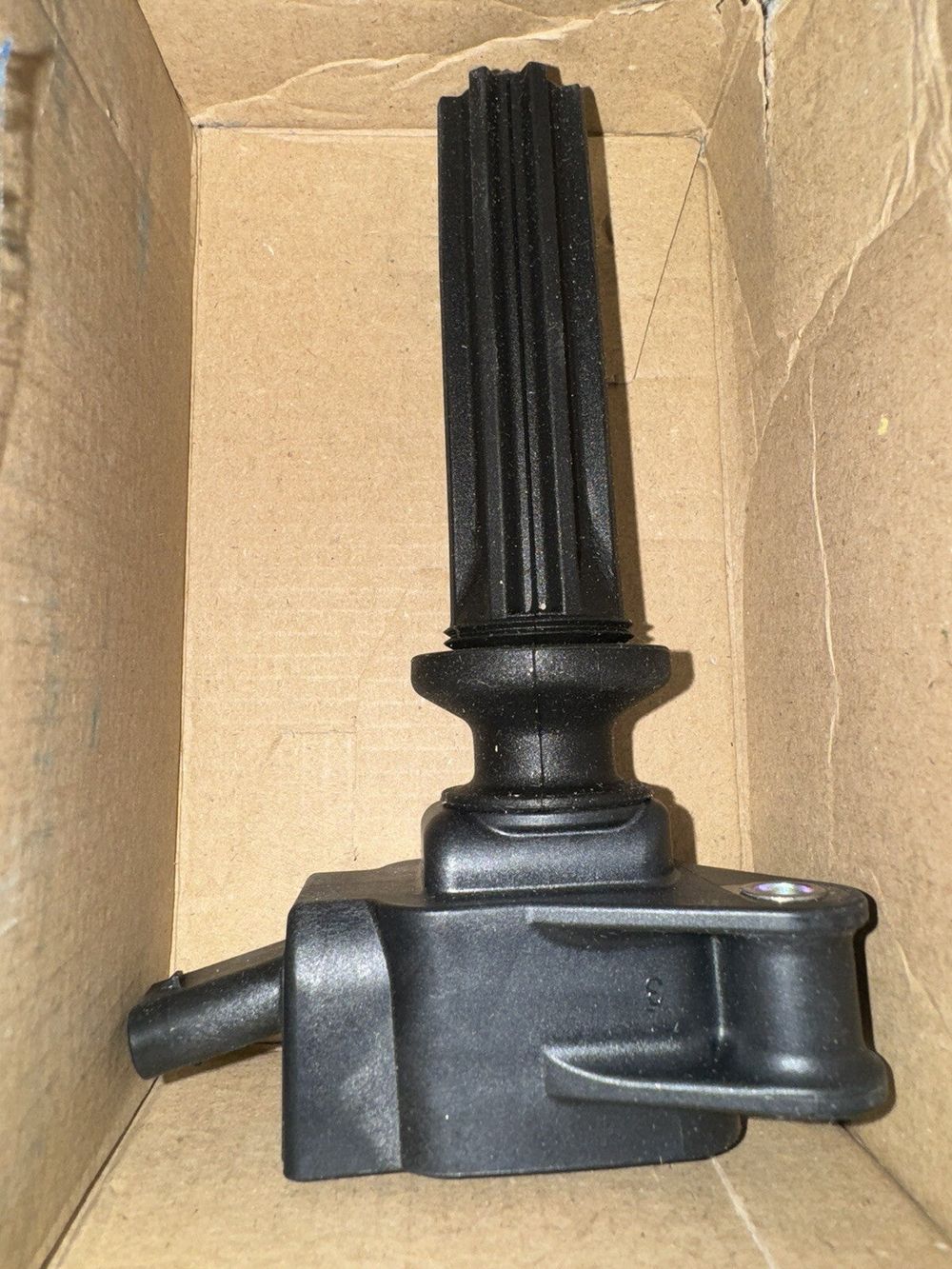 BOSCH 0221604700 Ignition Coil - Compatible With Select Ford EcoSport, Edge, Es – a box with a black handle and a black handle