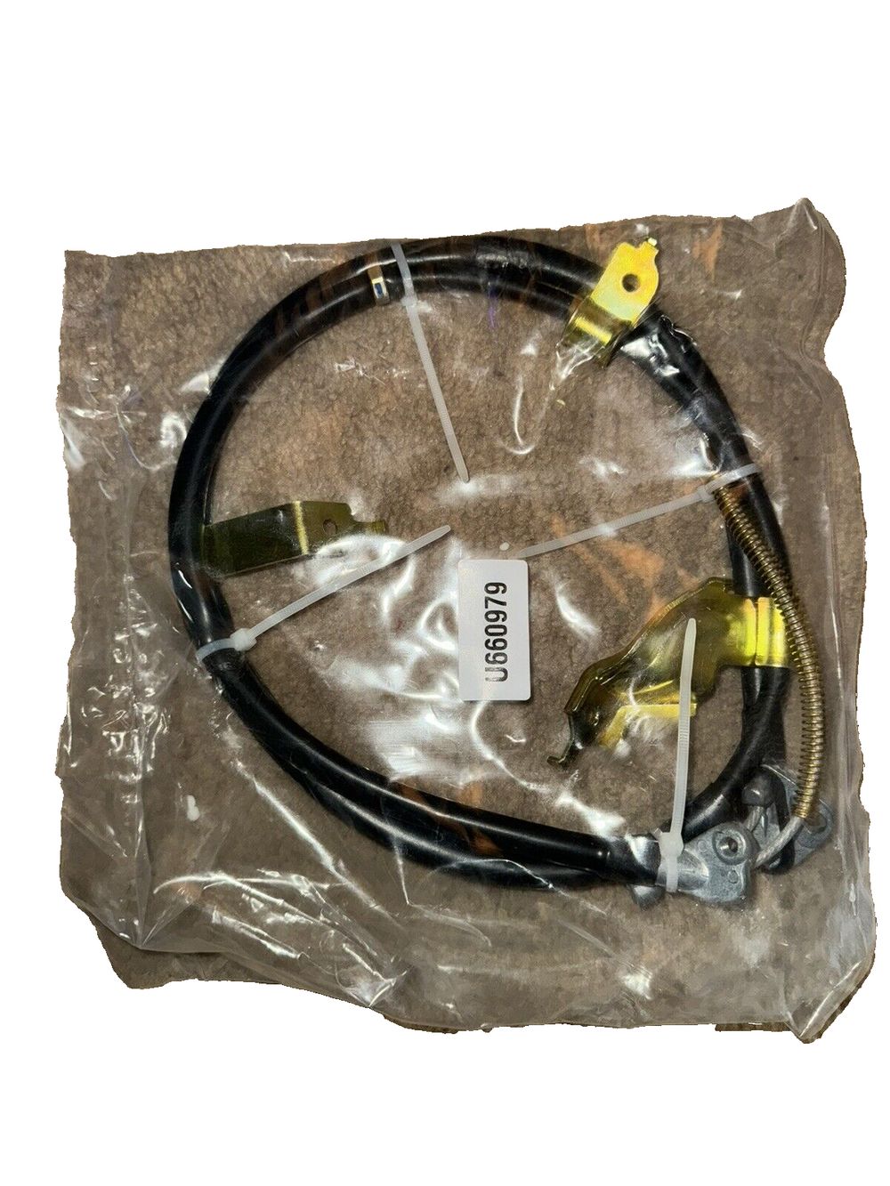 Dorman C660979 Rear Driver Side Parking Brake Cable Compatible with Select Toyot – a black cable with a yellow cord