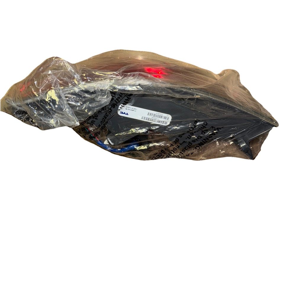TYC 11-6422-00 Mazda CX-9 Replacement Tail Lamp – a bag of plastic material on a white background