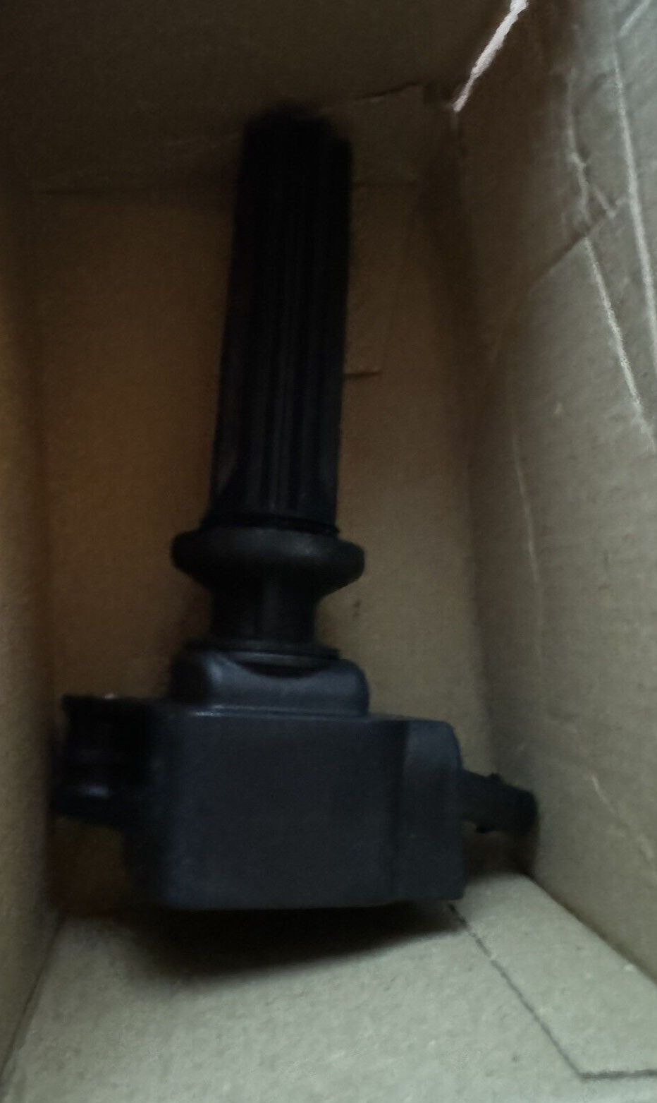 BOSCH 0221604700 Ignition Coil - Compatible With Select Ford EcoSport, Edge, Es – a black object in a cardboard box
