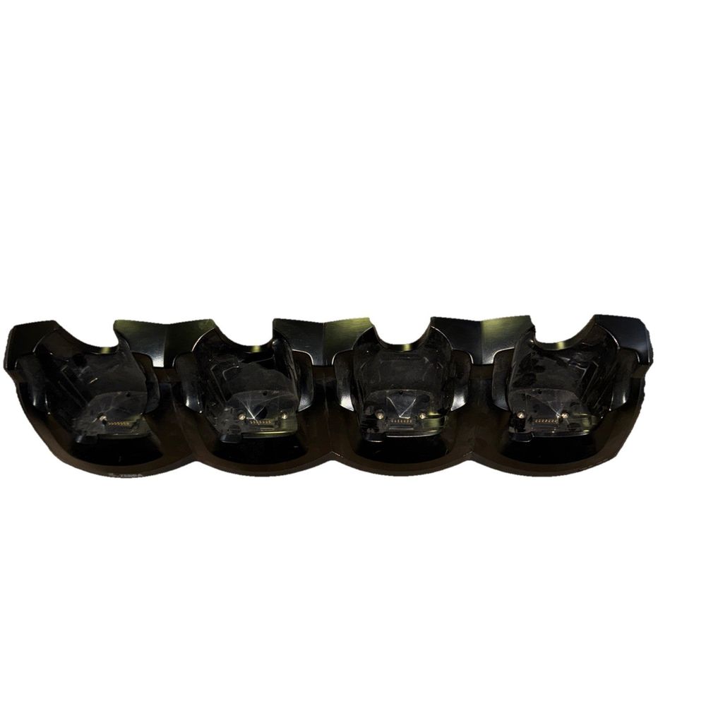 CRD5501-4000ER - Zebra MC55, MC65 Charging Cradle (4-Slot) (No Power Cable) – a group of four black plastic cups