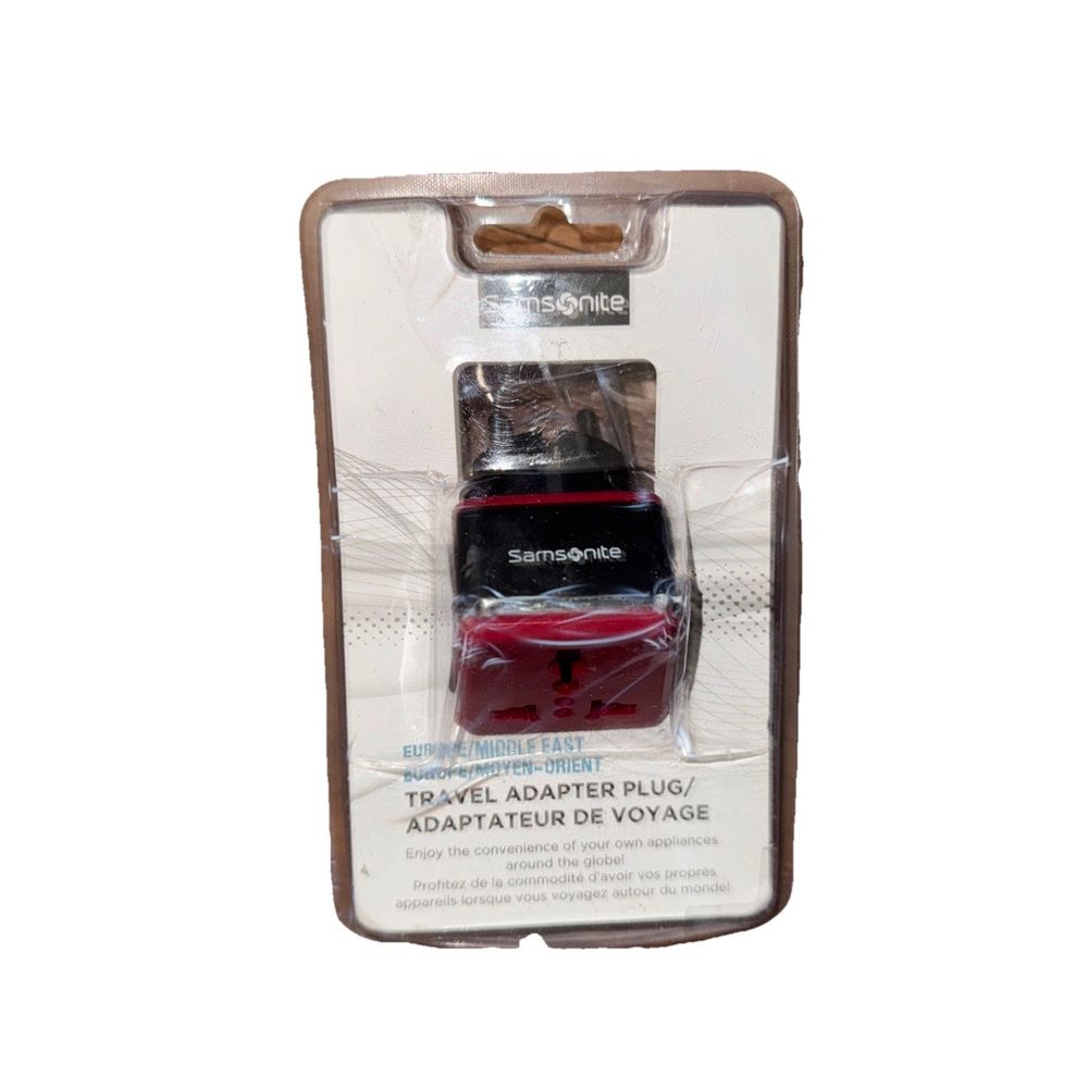 Samsonite Travel Adapter plug Europe/Middle East – a bottle of red liquid in a cardboard box
