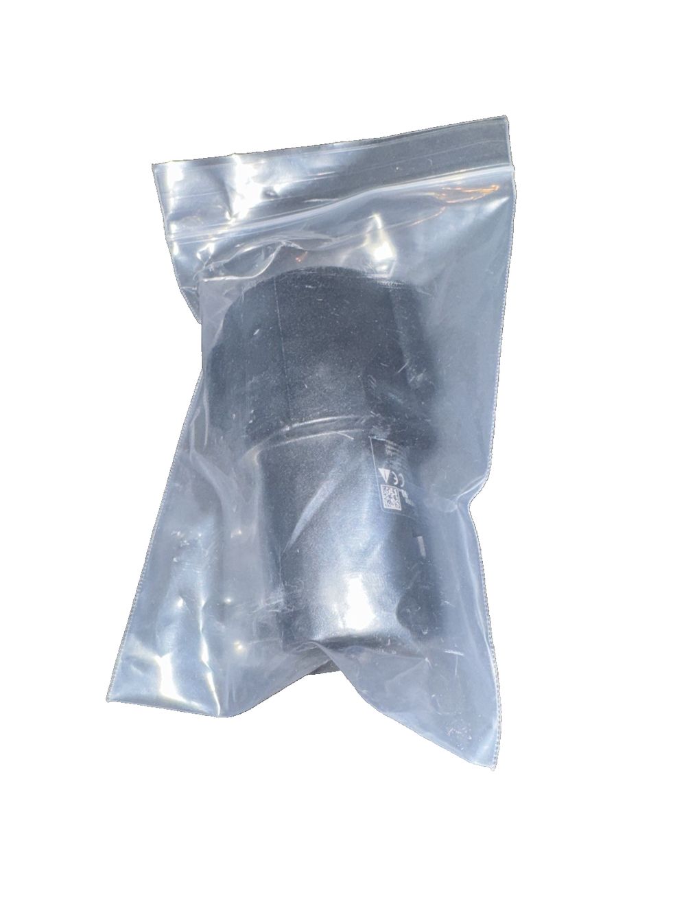 1067348-00-c Charging Adapter, Unbranded – a clear plastic bag with a white background
