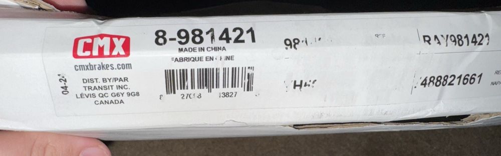 CMX 8-981421 Brake Disc Front for Mazda CX-3 3 Sport 2014- – a person holding a box with a label on it