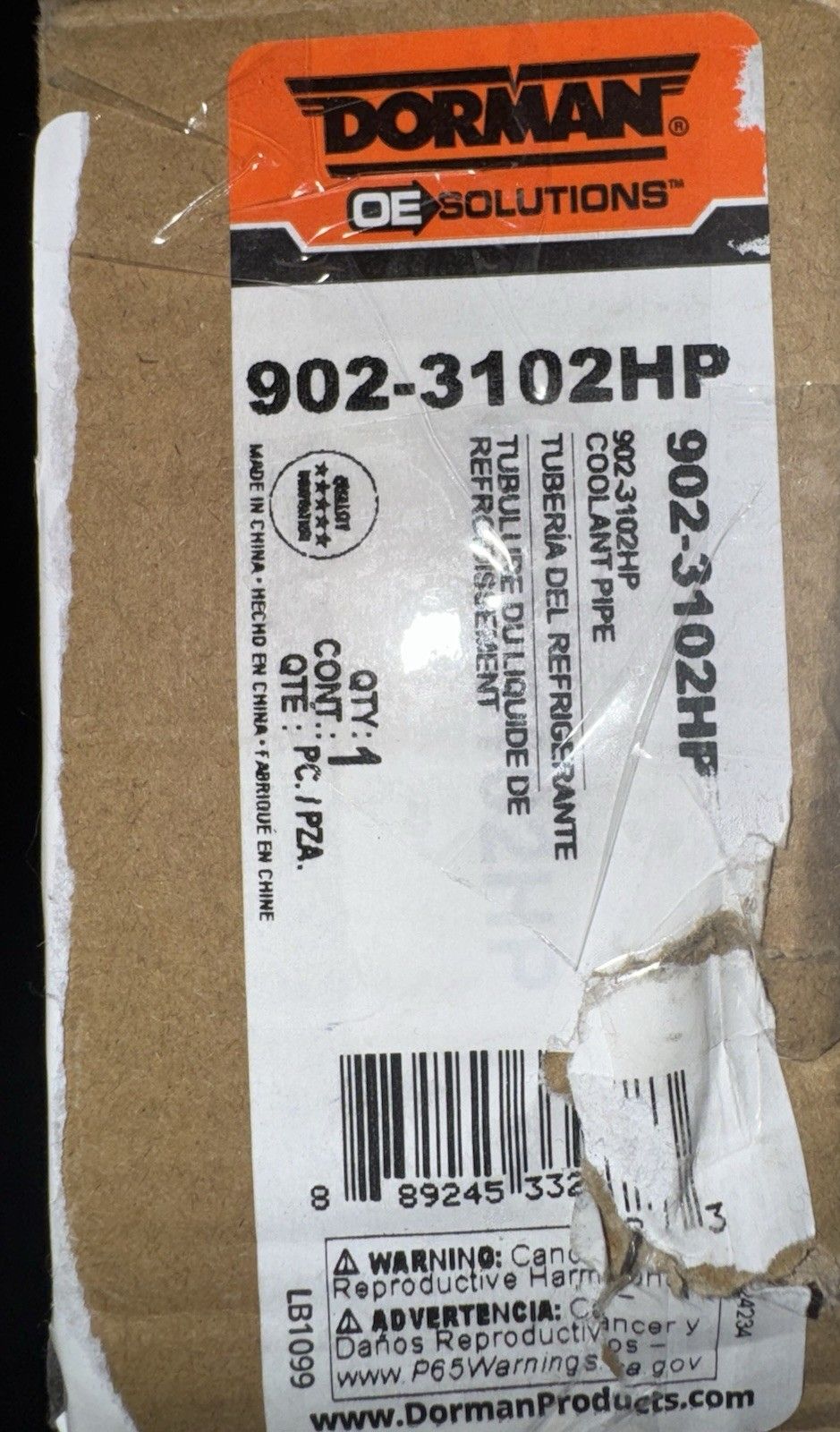 Dorman Engine Coolant Crossover Pipe 902-3102HP – a bag of brown paper with a label on it