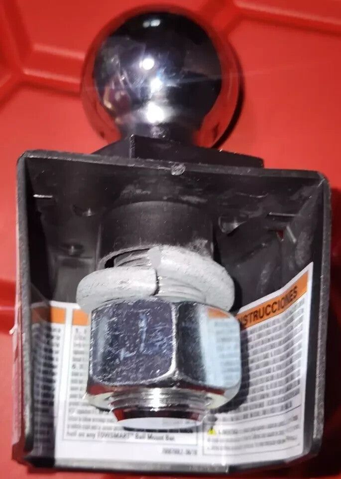 Reese Towpower 7008700 1-7-8" Chrome Steel Interlock Hitch Ball – a small black object sitting in a box