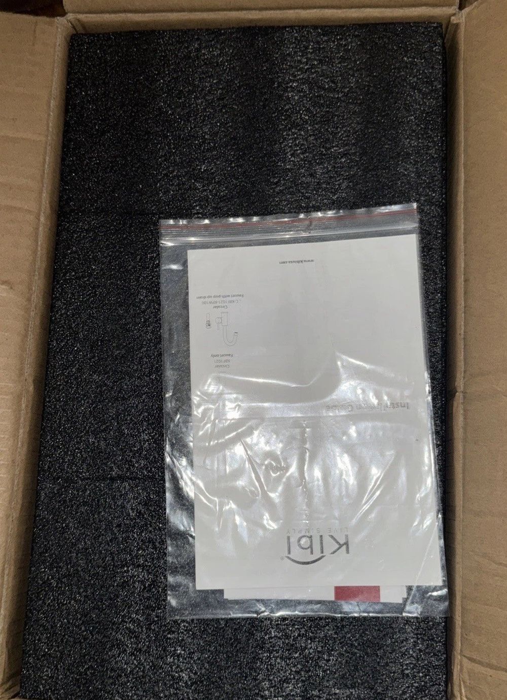 KIBI Single Handle Bathroom Sink Faucet with Pop Up Drain KBF1021 – a box with a white sign on it