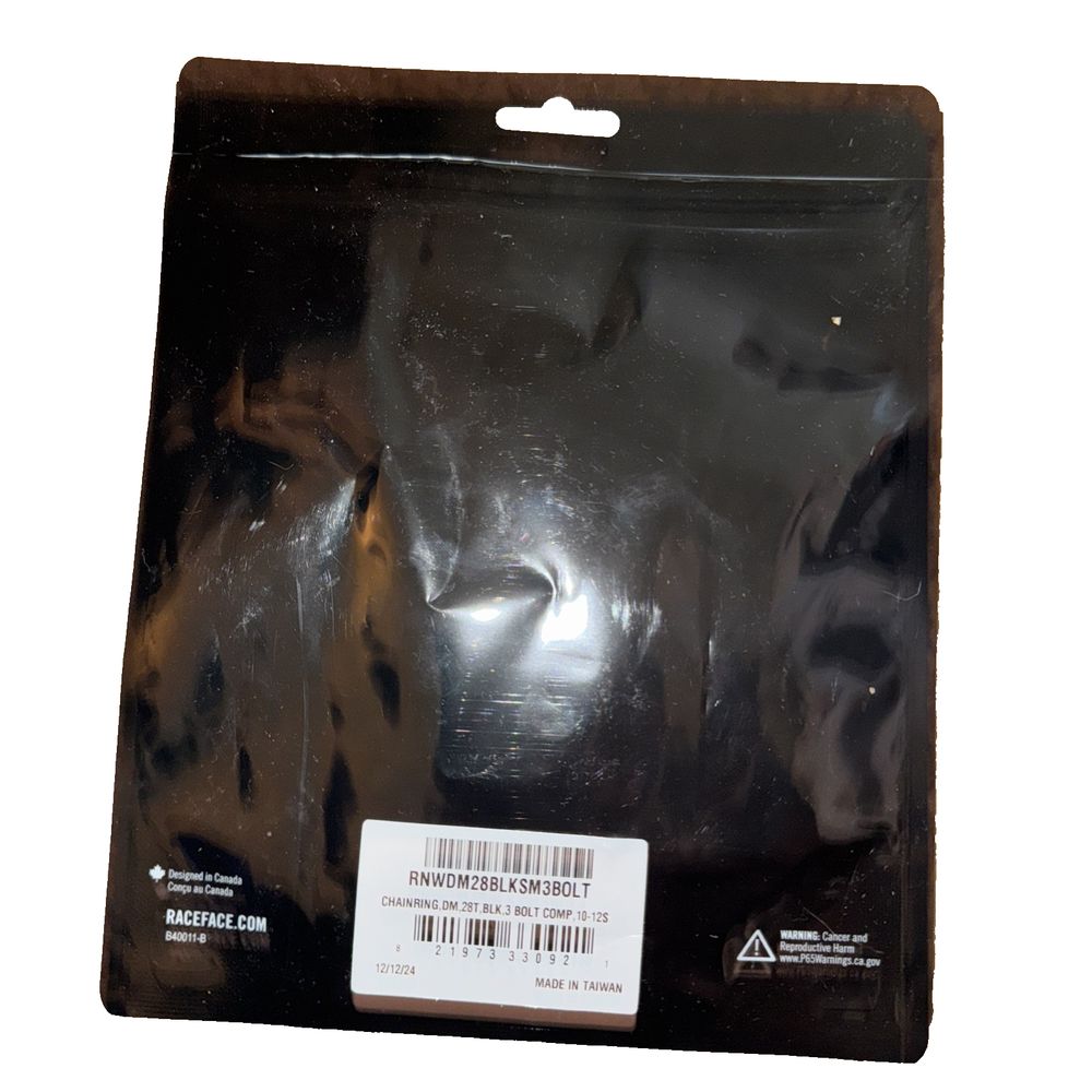 RaceFace Narrow Wide Chainring: Direct Mount 3-Bolt Compatible, 28t, Black, Race Face – a black plastic bag with a white label
