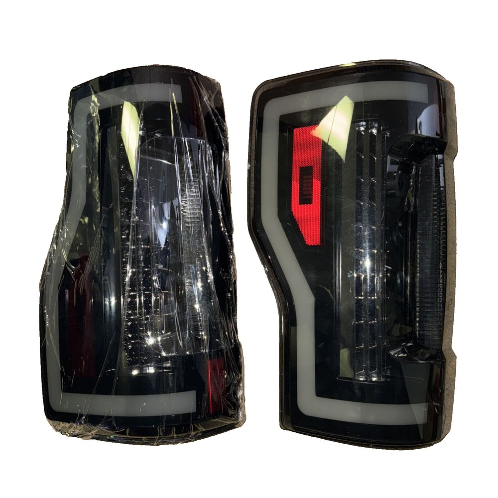 Winjet LED Tail Lights for 2017–18 Ford F250–F450 w/Sequential Signals – a pair of black headlights with red and white lights