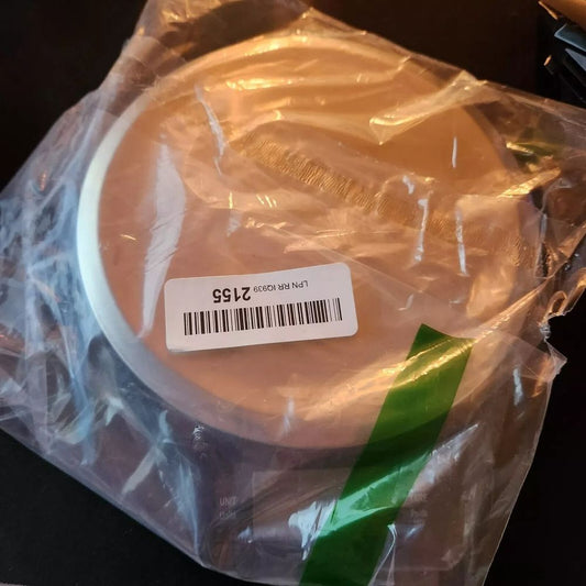 Amazon Basics Digital Kitchen Scale with LCD Display, Batteries Included, AmazonBasics – a white cake in a plastic bag