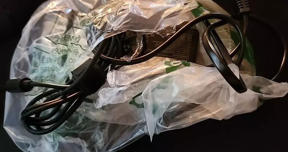 Lenovo ThinkPad DK1522 USB 3.0 Pro Dock 65W 03X6897 (40A7) | Connect Up to 4K Di – a pair of glasses sitting on top of a plastic bag