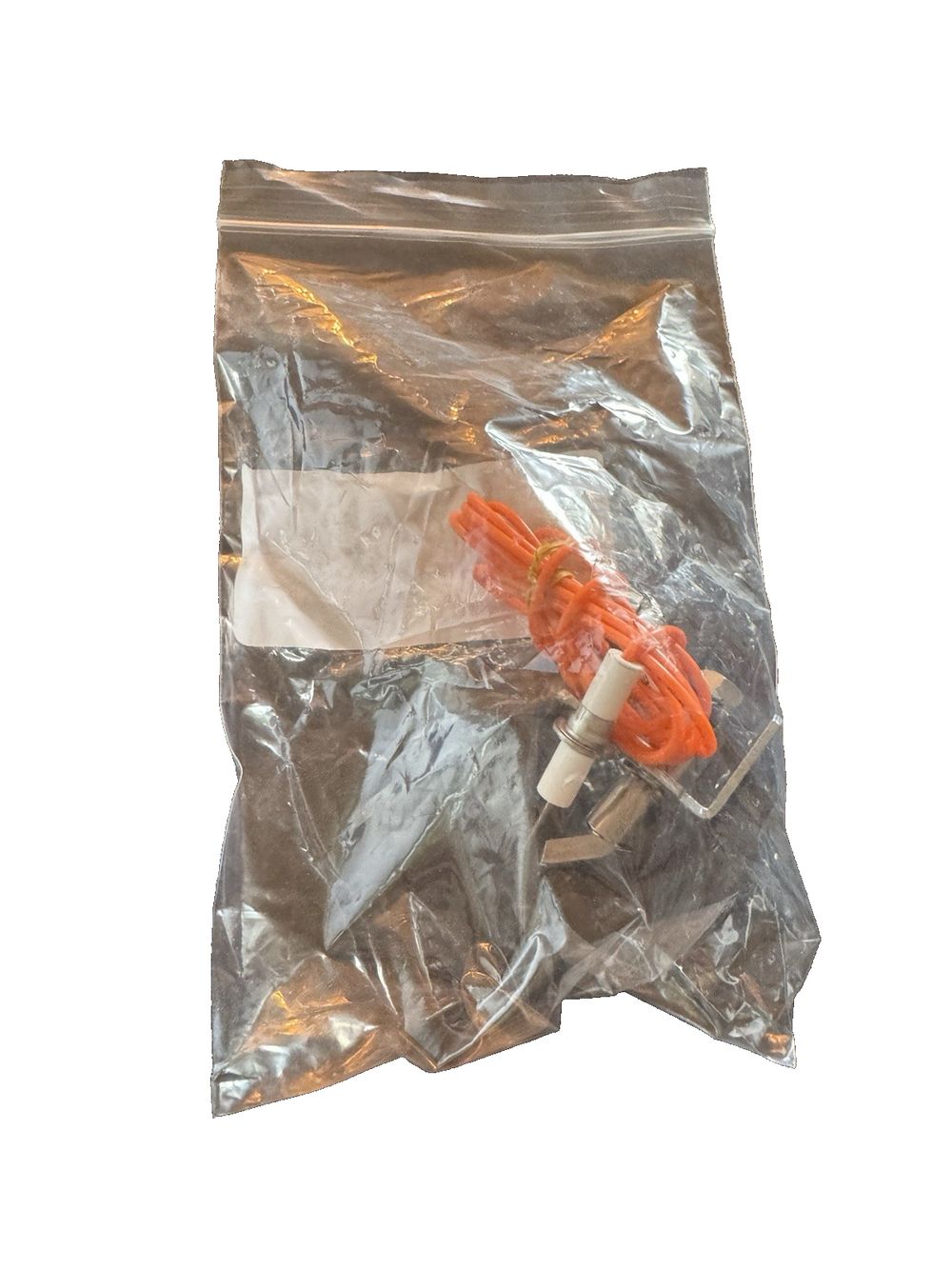 Pilot, Natural Gas Pilot, A3-S, 2SH60 (9.802-685.0), Unbranded – a plastic bag with a plastic orange object inside