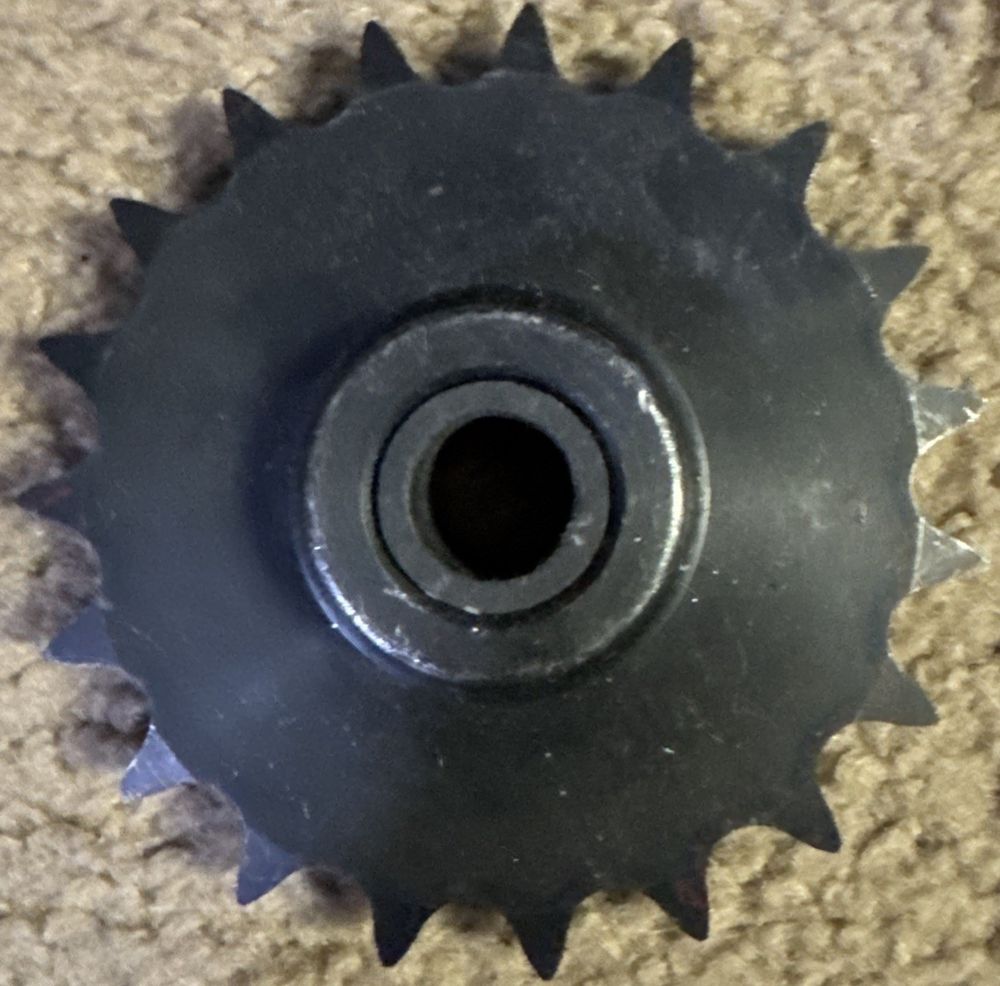 EG H50B19 20108 RBL 1 SPROCKET 19 TEETH – a black spe on the ground