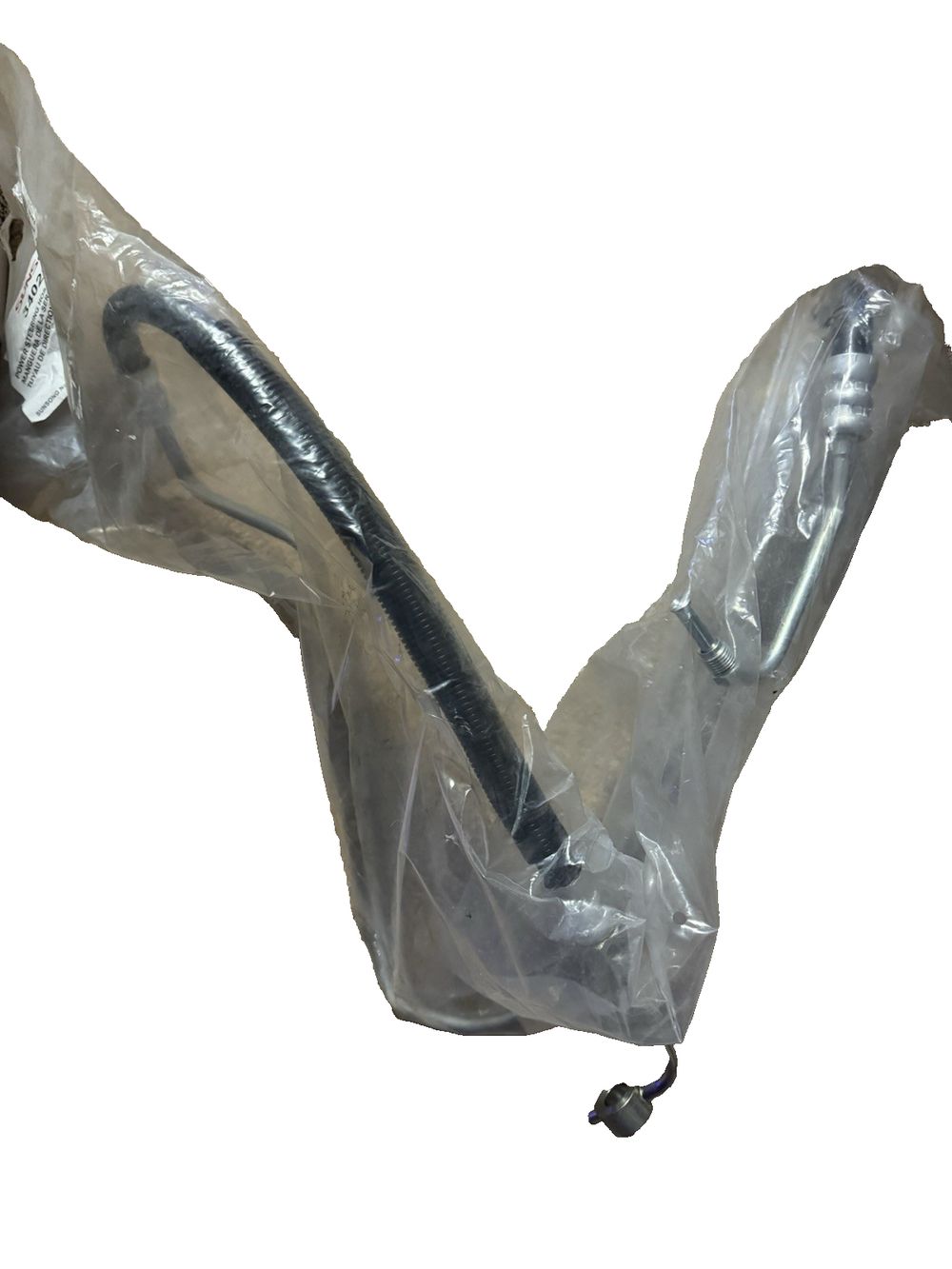 Sunsong 3402246 Power Steering Pressure Hose Assembly (Nissan), Sunsong North America – a plastic bag with a handle on it
