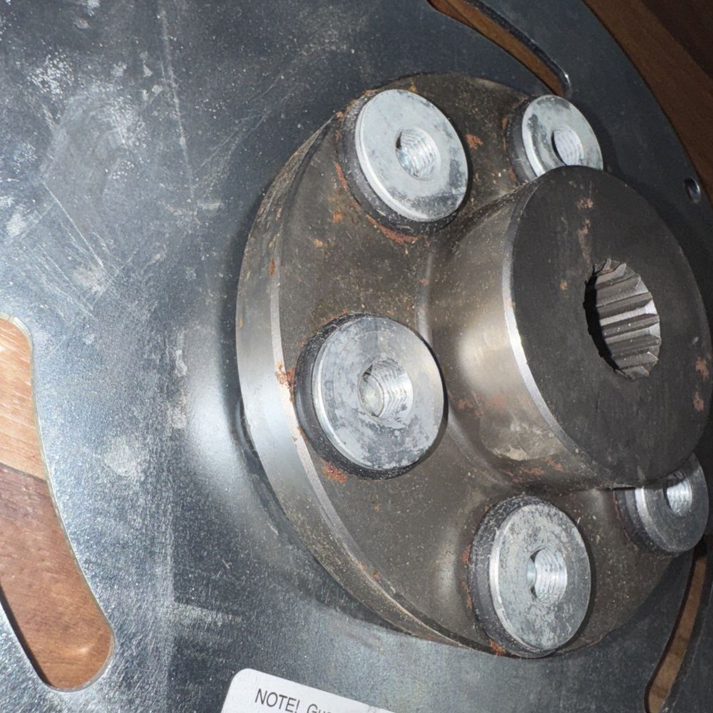 Genie Lift Part #128022GT - Guardian Couplings – a close up of a metal object with a wooden handle