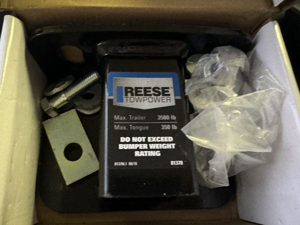 Reese Towpower 81378 Class II Step Bumper Receiver Hitch, Black – a box with a couple of screws and a box with a couple of screws