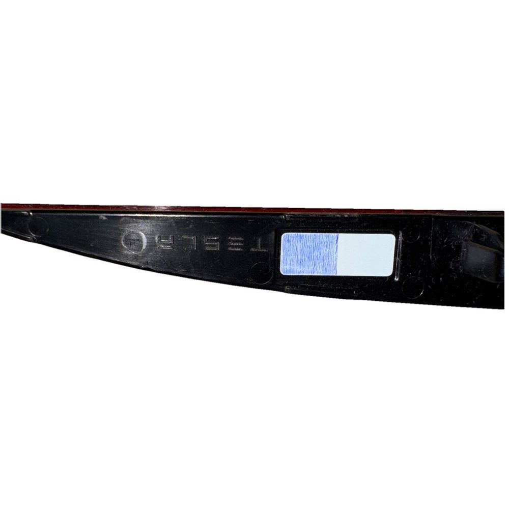 Tesla Left Rear Bumper Reflector PN 1495817-00-C | Genuine OEM – a black plastic ruler with a white background