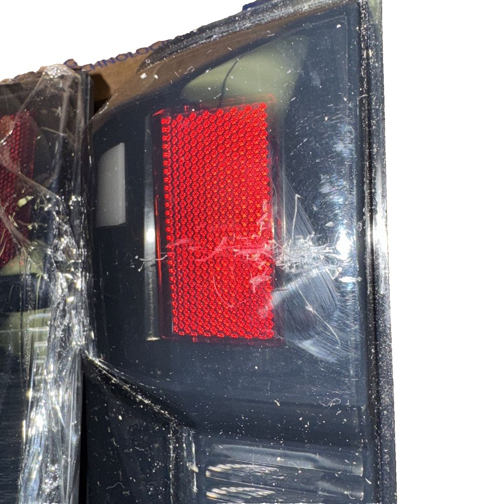 Winjet LED Tail Lights for 2017–18 Ford F250–F450 w/Sequential Signals – a red light is on a black object